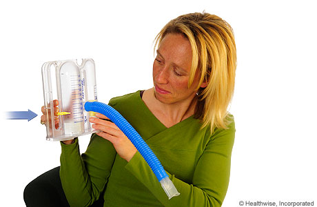 A person moving the slider on a spirometer