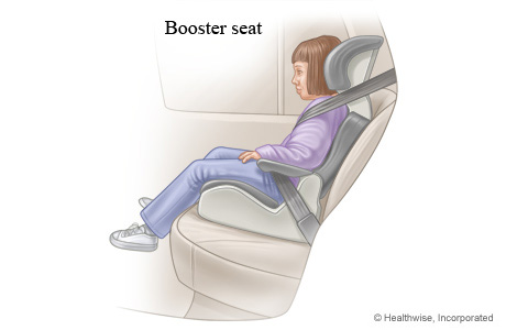 Young child in a booster seat